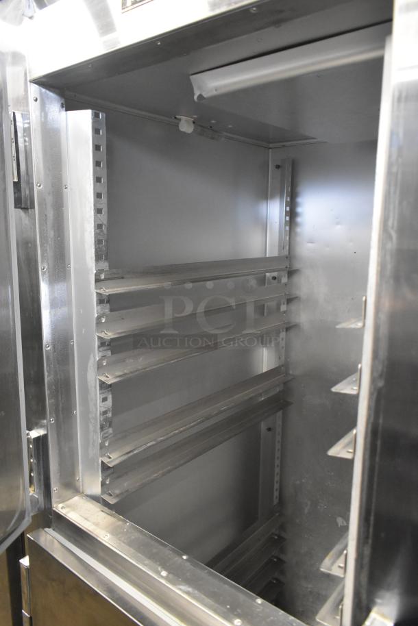Traulsen ALT132WUT-HHS commercial freezer interior, stainless steel, two half-size doors, shelving visible, 115 volts, 1 phase.