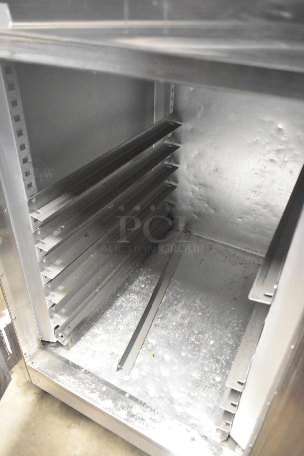 Traulsen ALT132WUT-HHS commercial half-size door reach-in freezer, visible interior, 115 volts, 1 phase, used condition.