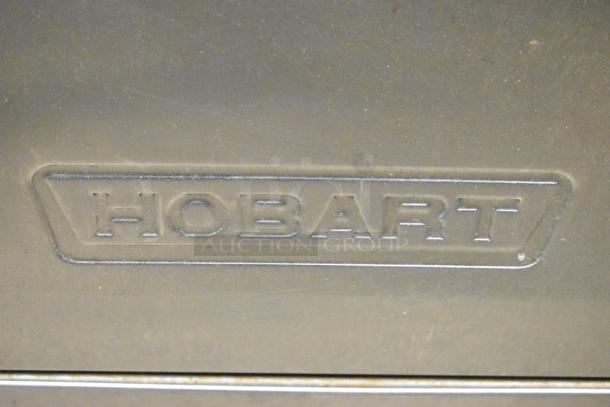 2018 Hobart LXER undercounter dishwasher, embossed logo detail, 120/208-240V, 1 Phase, excellent condition.
