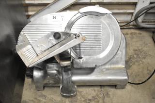 Berkel Commercial Countertop Meat Slicer with blade sharpener, 115 volts, 1 phase, in used condition.