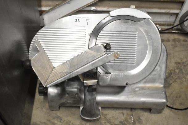 Berkel Commercial Countertop Meat Slicer with blade sharpener, 115 volts, 1 phase. Good condition, model unknown.