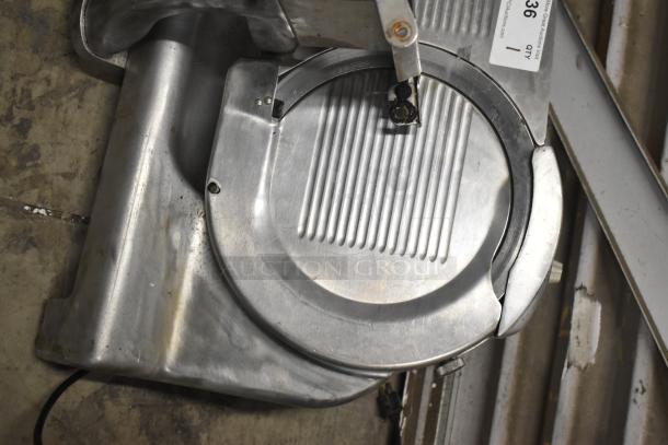 Berkel commercial countertop meat slicer with blade sharpener, 115 volts, 1 phase, visible tags, used condition.