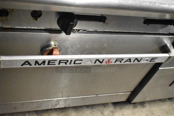 American Range AR-6 commercial natural gas 6 burner range with oven, over shelf, and backsplash, showing usage wear.