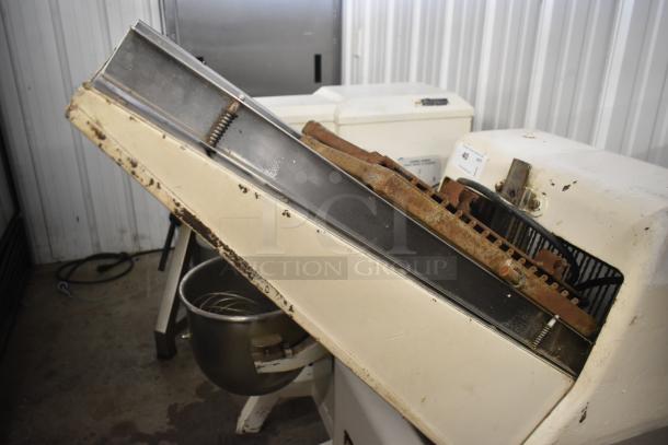 Commercial floor-style bread loaf slicer, 115 Volts, 1 Phase, white exterior, visible wear and rust on metal parts, used condition.