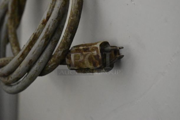 A rusted plug of a Univex M30 commercial dough mixer, highlighting wear and condition.