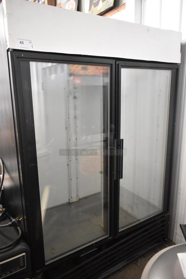 True GDM-49 commercial 2-door reach-in cooler merchandiser, 115 volts, 1 phase, glass doors, shelves, clean interior.