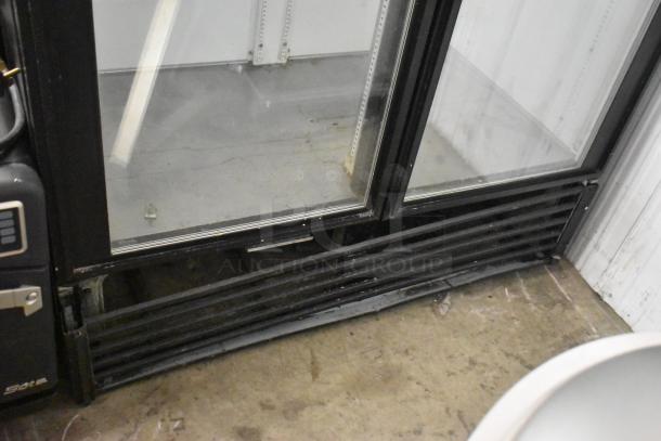 True GDM-49 2 Door Cooler Merchandiser, glass doors, black frame, 115V, industrial condition, shelves visible.