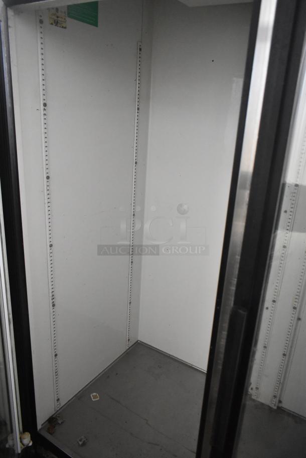 True GDM-49 commercial 2 door reach-in cooler merchandiser, 115 volts, 1 phase, interior view, some wear.