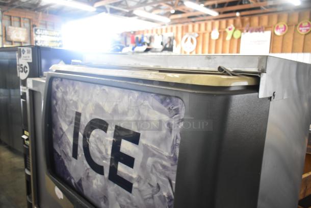 Scotsman ID250B-1A ice dispenser, commercial countertop model, 115 volts, 1 phase, silver exterior, "ICE" label visible.