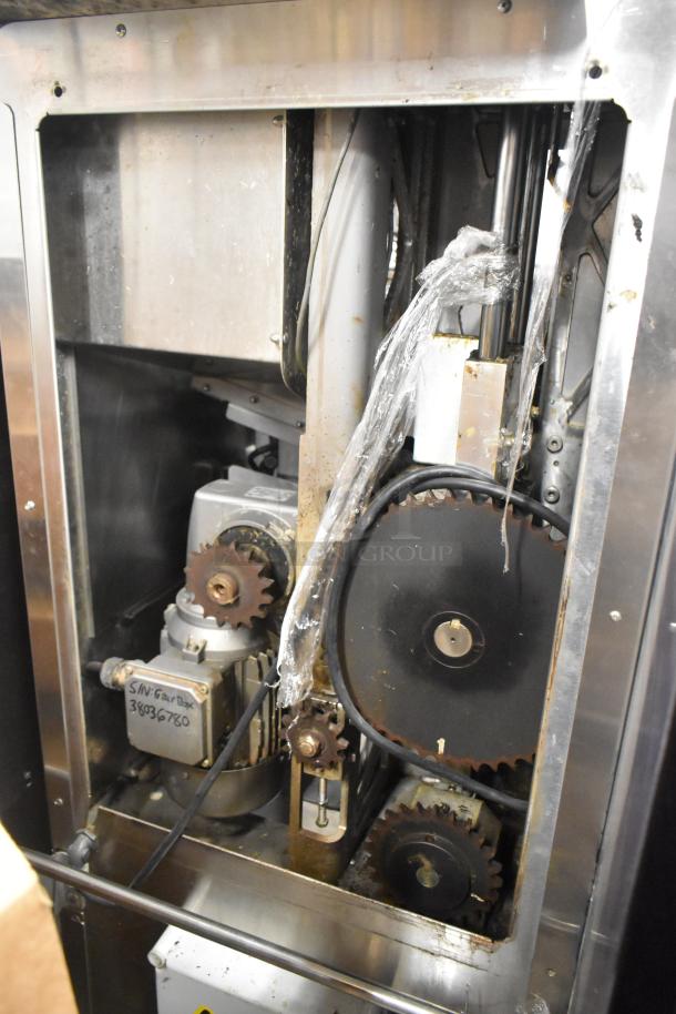 LATE MODEL JBT 2ND-GEN-MFJ-HE Citrus Juicer, commercial casters, 115V, key interior components, used condition.