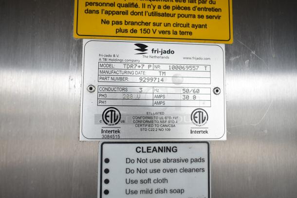Fri-jado TDR7+7 P rotisserie oven label showing model, part number, voltage, and cleaning instructions.