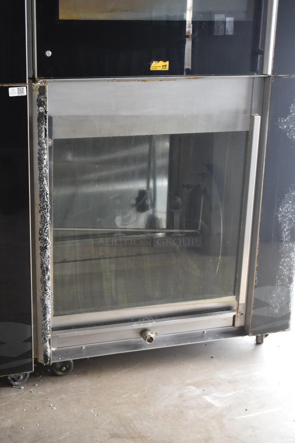 2 Fri-jado TDR7+7 P rotisserie ovens on casters, electric powered, 208V, 3-phase, broken glass visible.