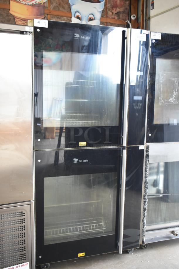 Fri-jado TDR7P electric rotisserie oven on casters, dual units, 208V, 3-phase, commercial condition, black glass doors.
