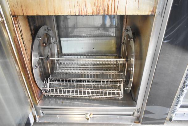 Fri-jado TDR7P commercial rotisserie oven interior, stainless steel, dual racks, signs of use, 208V, 3-phase.