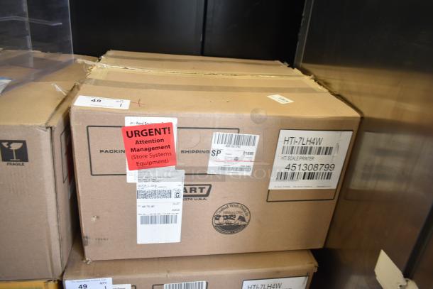 Boxed 2016 Hobart HTi-7LH commercial food portioning scale. Features include 120/208-240 volts, 1 phase. Tested and working.