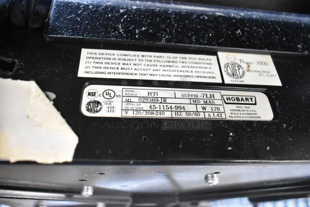 2016 Hobart HTi-7LH metal commercial countertop food portioning scale, model labeling visible.