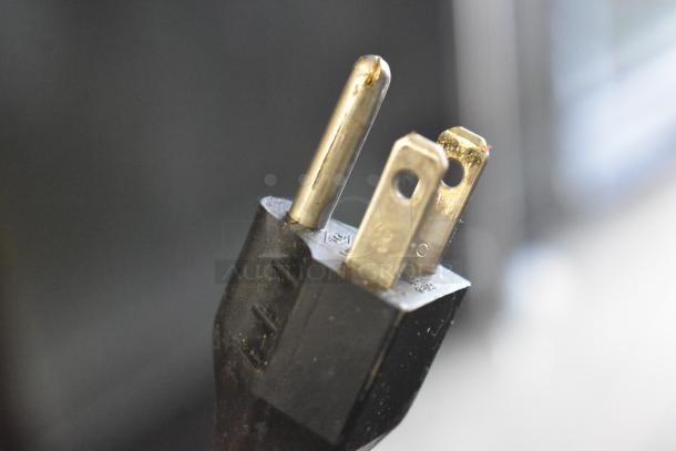 Close-up of a power plug for a 2016 Hobart HTi-7LH commercial food portioning scale, 120/208-240 volts, 1 phase.