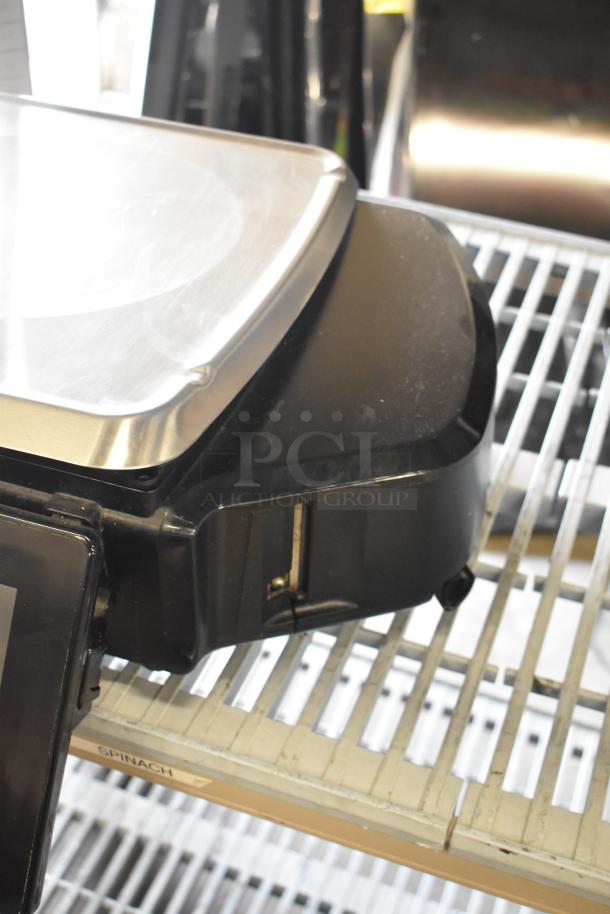 2017 Hobart HTi-7LH26 metal countertop food portioning scale. Black base, metallic tray. Tested and working condition.