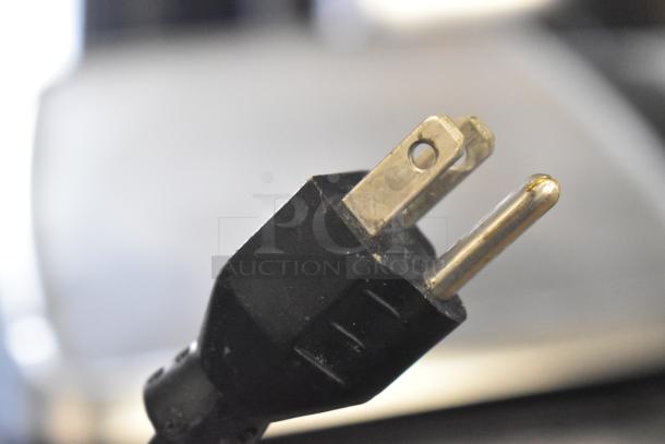 Close-up of a power plug for a 2017 Hobart HTi-7LH26 commercial food portioning scale. Tested and working condition.