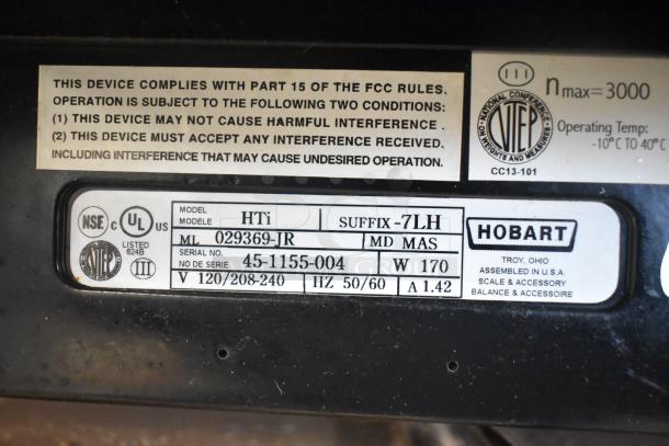 2016 Hobart HTi-7LH countertop food scale, 120/208-240V, tested; screen broken, does not power on. Compliance label visible.