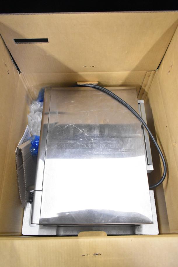 2022 Sharp R-21LVF Commercial Microwave Oven in packaging, stainless steel finish, 120 volts, 1 phase, new condition.