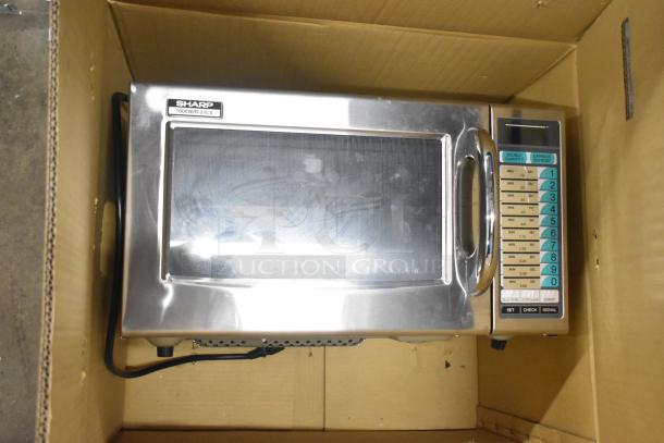 2024 Sharp R-21LVF Commercial Microwave Oven, stainless steel, 120 Volts, 1 Phase, keypad controls, new in packaging.