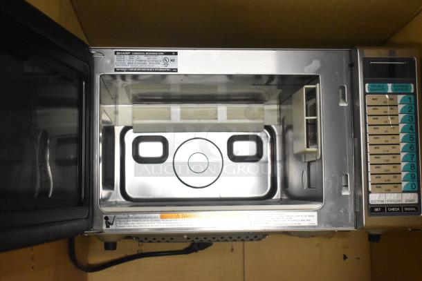 2024 Sharp R-21LVF Commercial Microwave Oven, stainless steel, 120V, 1 Phase, keypad controls, open door view.