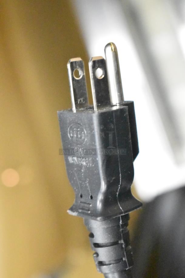 Power plug of Sharp R-21LVF commercial microwave oven, 120 volts, 1 phase. Close-up detail.