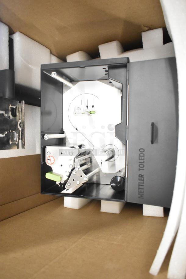 Mettler Toledo FreshWay Scale in packaging, 100-240 volts, 1 phase. Features internal components and branded side panel.