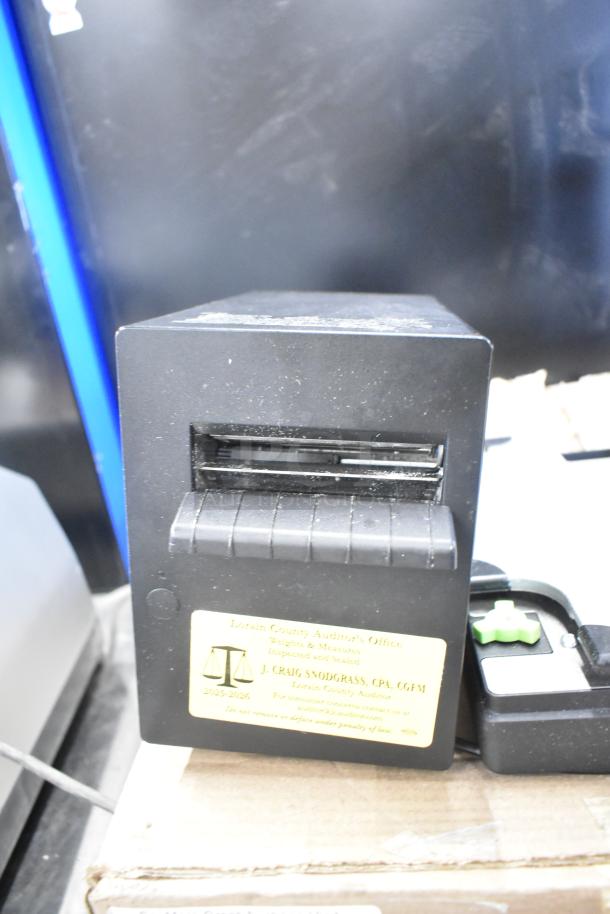 Mettler Toledo FreshWay Scale, black finish, voltage: 100-240V, 1 phase, with inspection label from Lorain County Auditor's Office.