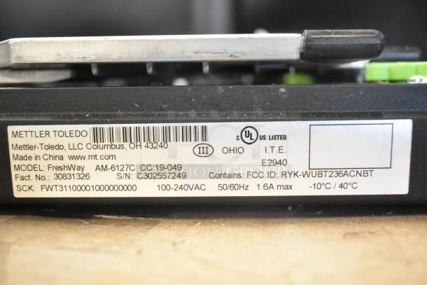 Mettler Toledo FreshWay Scale, model AM-6127C. Label shows 100-240V, 1 phase, FCC ID: RYK-WUBT236ACNBT, UL listed.