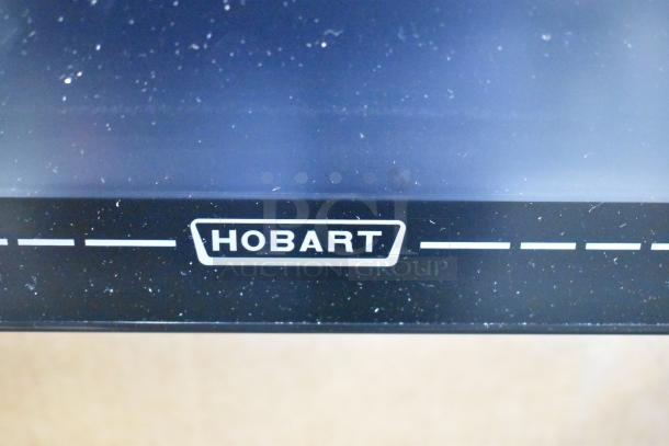 2024 Hobart HTi-7LH4W commercial countertop scale, black finish, tested and working. Visible Hobart logo.