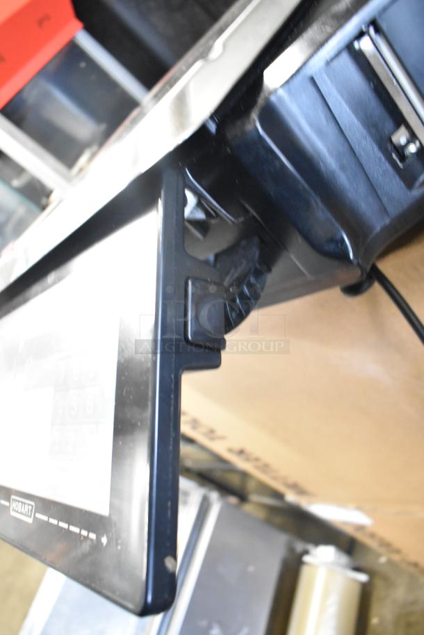 2024 Hobart HTi-7LH4W commercial countertop scale, tested and in working condition, black casing with touchscreen.