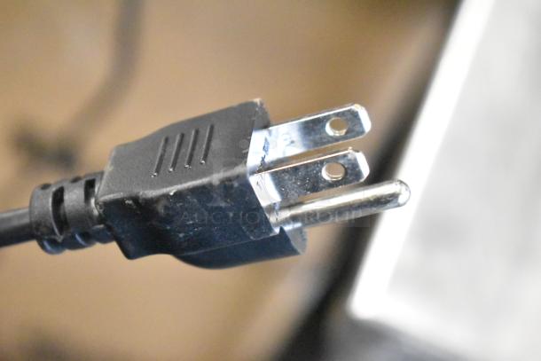 Close-up of a power plug for the 2024 Hobart HTi-7LH4W commercial countertop scale. 120/208-240 volts, 1 phase.