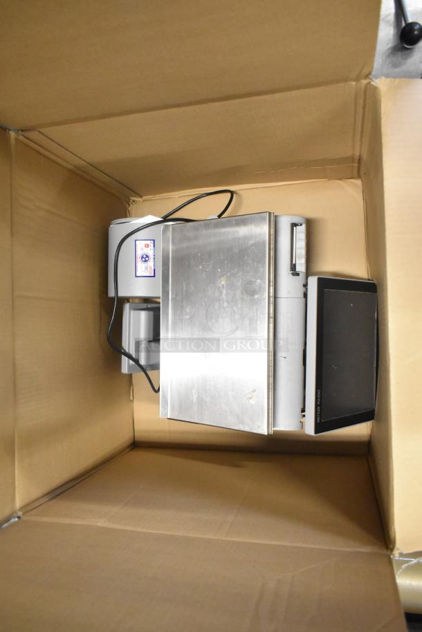 Mettler Toledo AM-5545 commercial countertop scale in cardboard box. Features stainless steel platform and digital display. Tested and working.