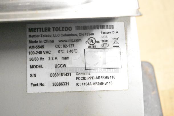 Mettler Toledo AM-5545 Commercial Scale, 100-240V, 1 Phase, tested working, with model and serial number label visible.