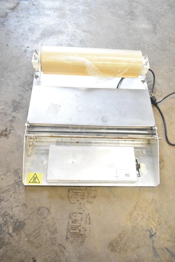 Countertop wrapping station, model 5000156, 115V, 1 phase, with roll holder and heated element. Good condition.