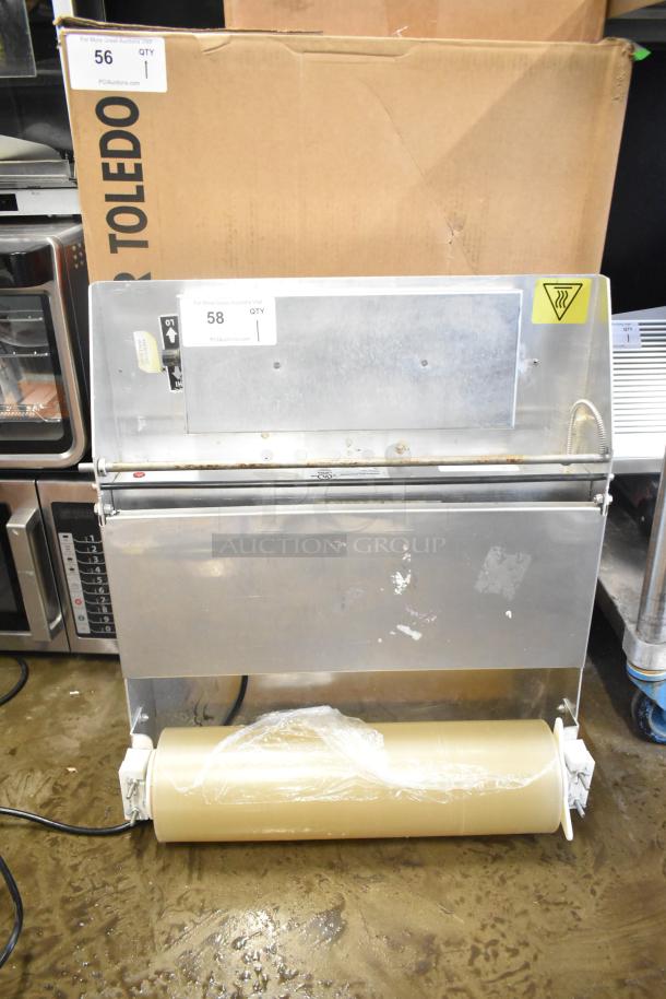 Countertop wrapping station, model 5000156, 115 volts, 1 phase. Features a stainless steel body and integrated roll holder.