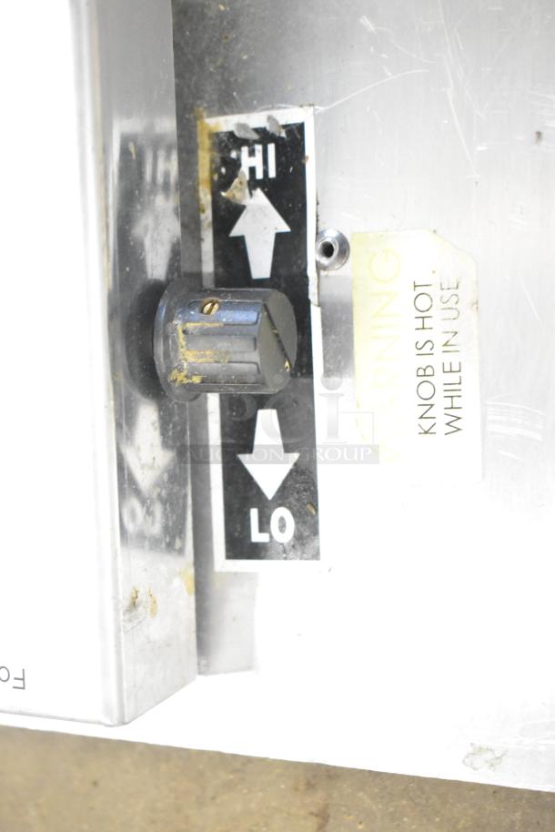 Countertop wrapping station model 5000156, 115V, 1 Phase, with adjustable temperature knob and warning label.