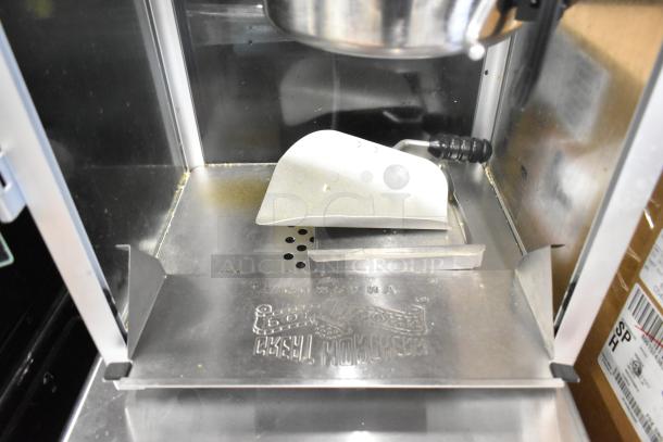 Great Northern Co 83-DT5634 countertop popcorn machine, stainless steel interior, visible scoop, 120 volts, 1 phase.