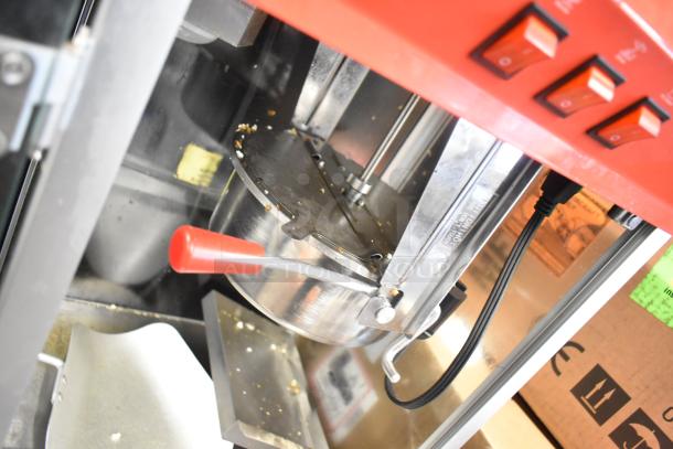 Great Northern Co 83-DT5634 countertop popcorn machine with red controls, metal kettle, 120 volts, 1 phase, and visible wiring.
