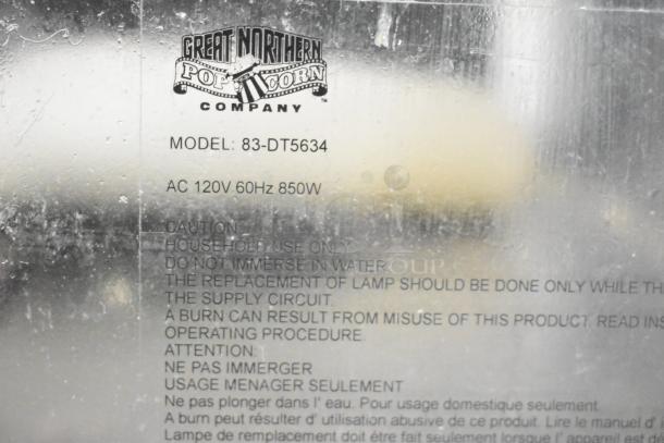 Great Northern Co 83-DT5634 popcorn machine label, model 83-DT5634, 120V, 1 phase, caution instructions visible.