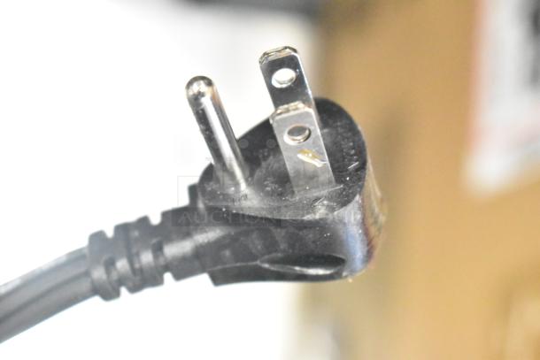 Power plug of Ninja DT SERIES J0 Countertop Foodi Smart XL Air Oven, 120 volts, 1 phase. Close-up view.