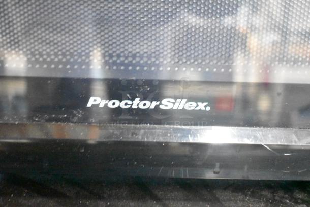 Proctor Silex PS-P70T20AL-V1B countertop microwave, features logo on front, 120V, includes plate, used condition.