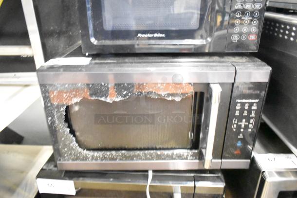 2024 Hamilton Beach HB61B100027880 microwave with broken glass door, countertop model, 120V, 1 phase, includes plate.