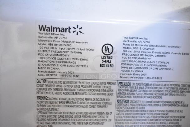 2024 Hamilton Beach HB61B100027880 microwave oven label, 120V, 1000W output, broken glass noted, manufactured January 2024.