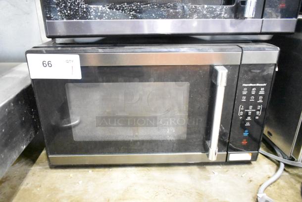 2024 Hamilton Beach HB61B100027880 countertop microwave oven, black, with digital controls and stainless steel handle.