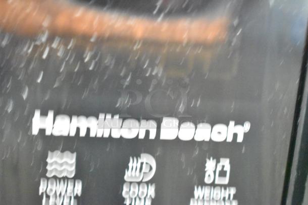 2024 Hamilton Beach HB61B100027880 countertop microwave, black finish, visible control icons, 120 volts, 1 phase.