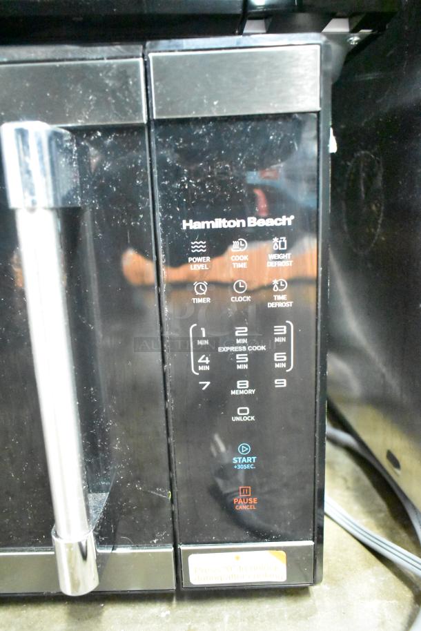 2024 Hamilton Beach HB61B100027880 countertop microwave, 120V, 1 phase, digital controls, black finish, visible wear.