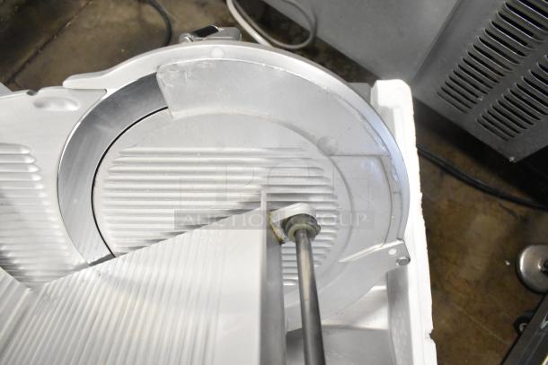 Bizerba GSP HD commercial meat slicer, blade detail, 120 volts, 1 phase, in good condition, visible wear.